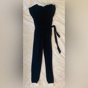 Black soft-spun v-neck jumpsuit.